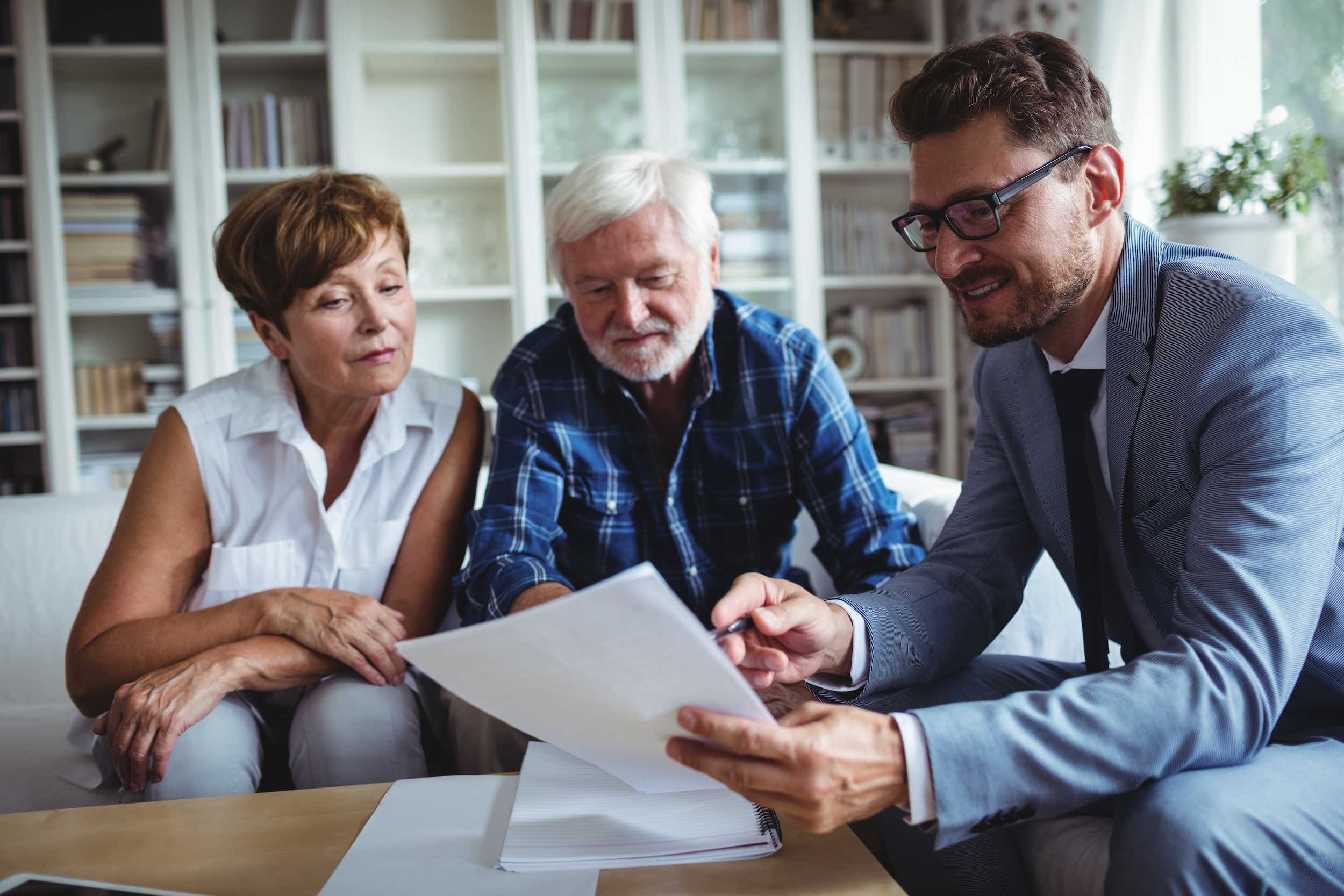 Senior couple planning their investments with financial advisor Retirement